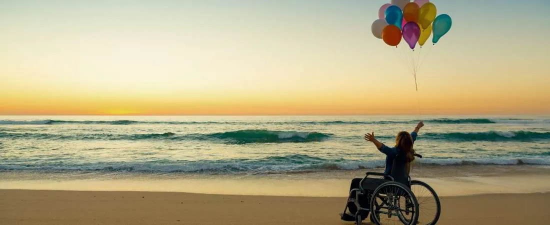 woman on wheelchair holding balloon Waiver of Premium Rider