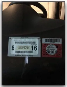 Attach the registration sticker to the right of the inspection sticker