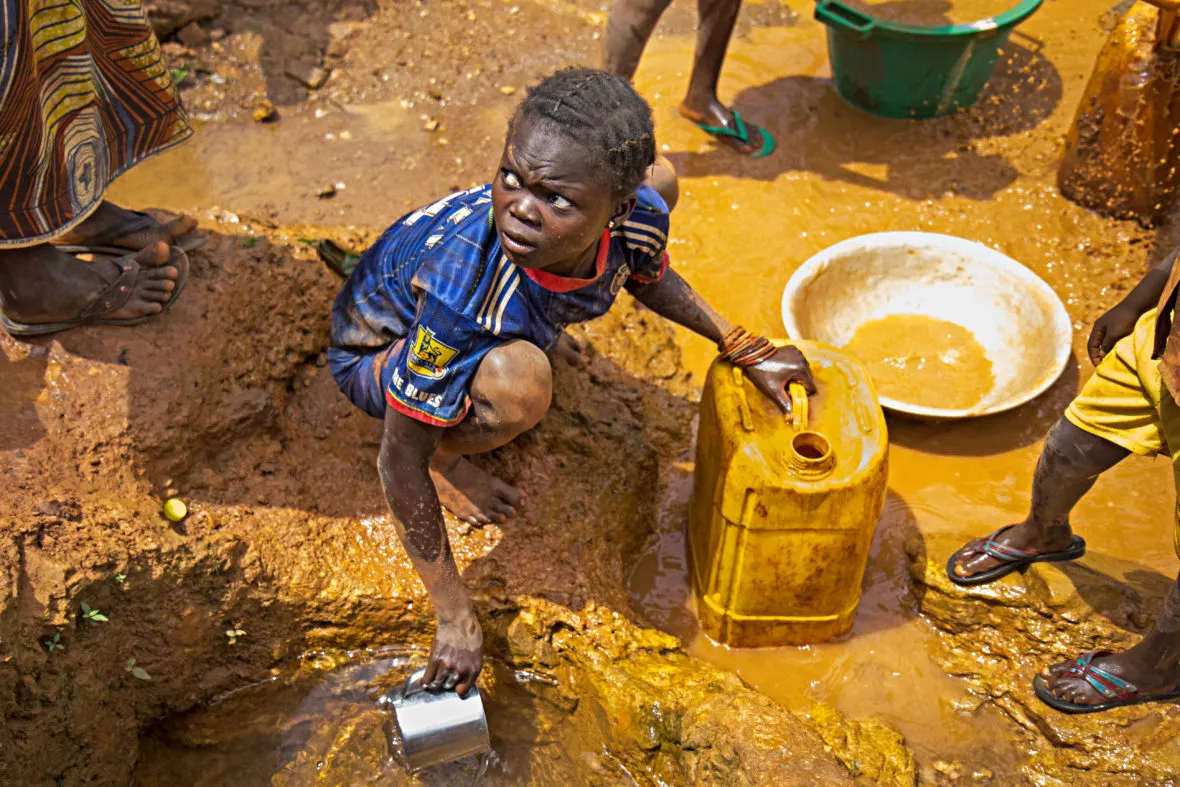 Young girl collects water in CAR
